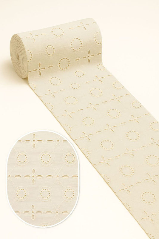 Vintage style off-white cotton fabric with delicate Hakoba/Schiffli embroidery in a timeless dot pattern, 44 inches wide.