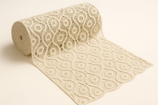 "Unlock the potential of this 100% pure cotton GPO lace fabric! This premium dyeable white textile showcases a gorgeous, intricate banded floral guipure pattern. Just like the dress the model wears in the sample photos, this soft and breathable material drapes beautifully. It's the perfect choice for tailoring a custom bridal overlay, resort dress, or high-fashion ethnic outfit!"