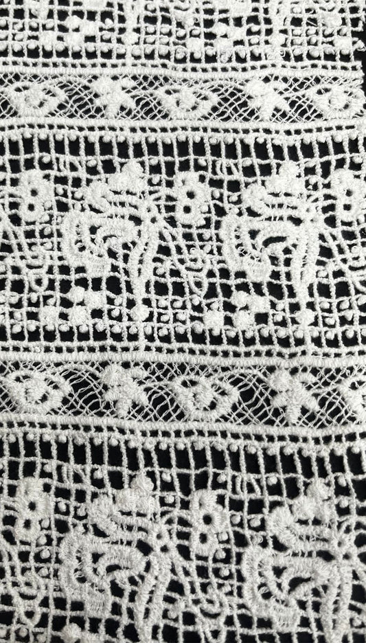 "Craft your dream outfit with this gorgeous 100% pure cotton GPO lace fabric! This dyeable white guipure textile features a stunning, intricate leaf and wave-inspired pattern with exquisite detailing. Its super soft and breathable texture makes it the perfect summer fabric for tailoring light beach cover-ups, high-fashion overlays, breezy ethnic kurtis, or stylish Indo-Western dresses!"