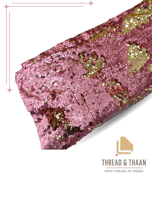 Dazzling reversible pink and gold sequin net fabric (44-inch width) with a dramatic, shimmering effect, perfect for designer lehengas, gowns, and sarees.