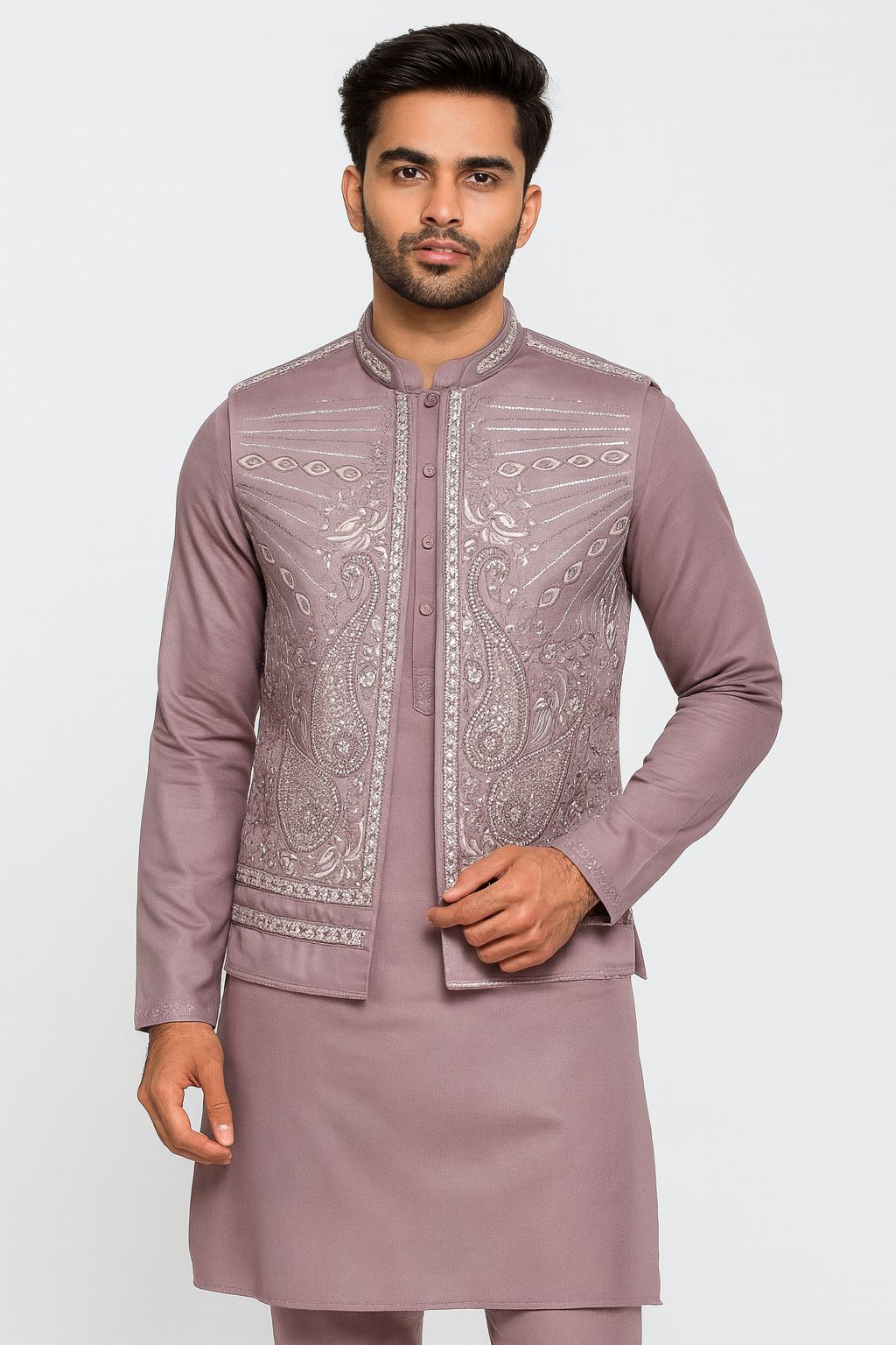 "Stand out beautifully in this sophisticated lavender (or mauve) men's Kurta Koti Pajama Set! Our model showcases this premium ethnic outfit, featuring a matching embroidered koti (waistcoat) adorned with elegant silver and white paisley and floral motifs. The fine detailing and shimmering highlights blend modern style with traditional charm, making it perfect for weddings, formal parties, or festive celebrations!"