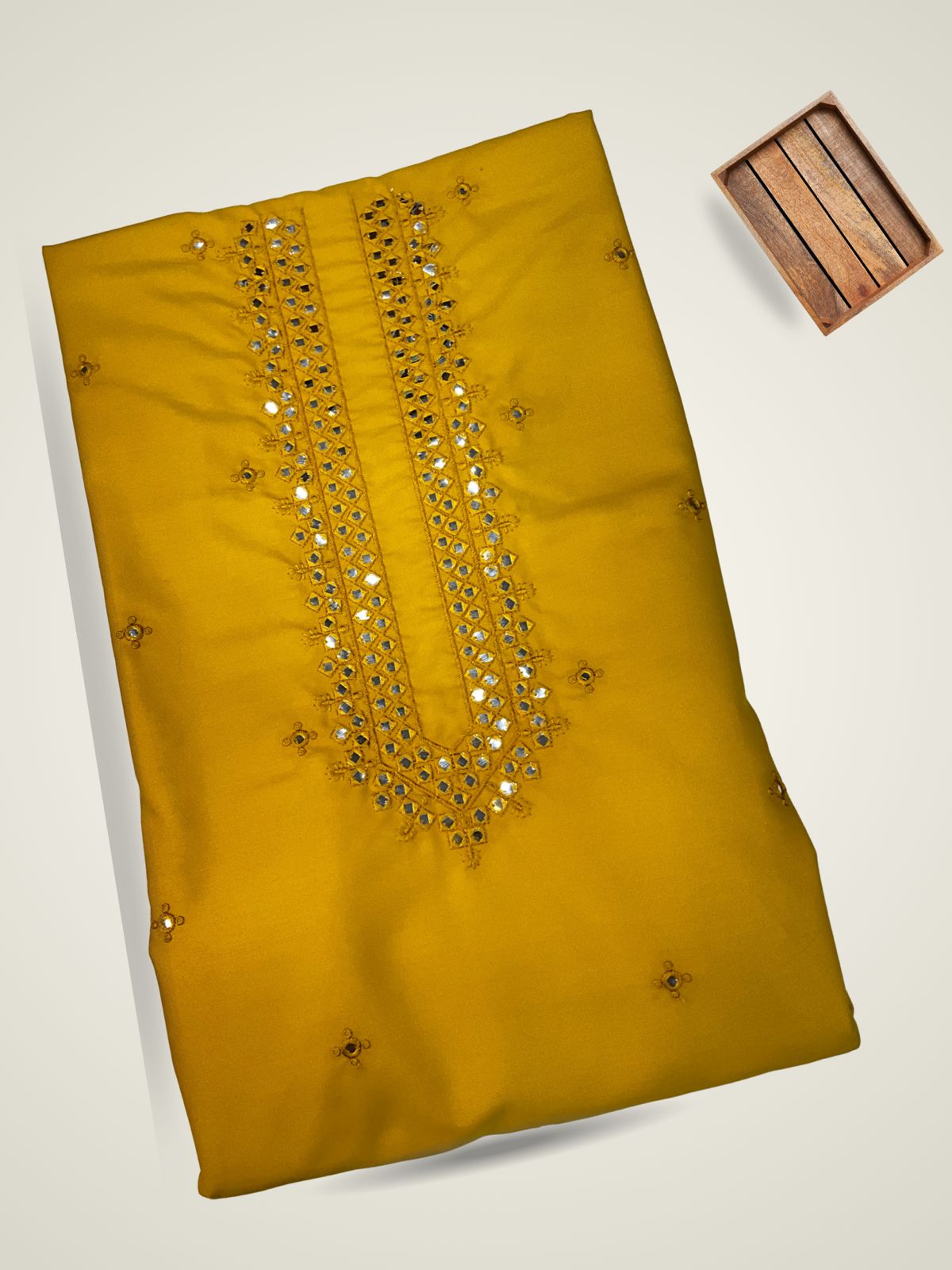 "Brighten your wardrobe with this stunning mustard yellow unstitched kurta fabric for men! It features rich, intricate gold embroidery and shimmering mirror work (shisha work) embellishments along the detailed V-neckline. This vibrant premium ethnic fabric is ideal for tailoring a stylish men's kurta pajama set perfect for Haldi ceremonies, festive occasions, and Sangeet celebrations."