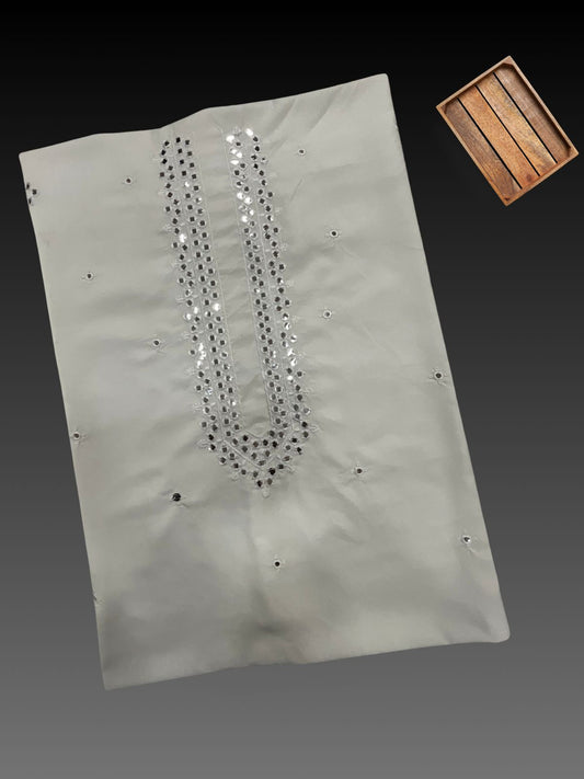 Unstitched White kurta fabric piece featuring heavy mirror work (shisha or abhla work) and silver sequin embroidery along the neckline in a V-shape or U-shape. This premium cotton/silk blend men's fabric is designed for a kurta pajama set suitable for Sangeet, Mehndi, or festive events.