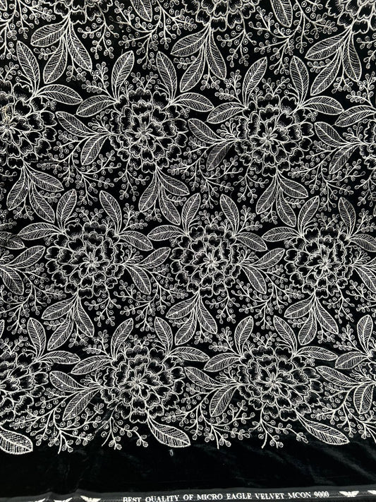 "Beautiful new black velvet fabric with dense, delightful white and silver floral embroidery. It's so plush and ready for your most glamorous creations!"