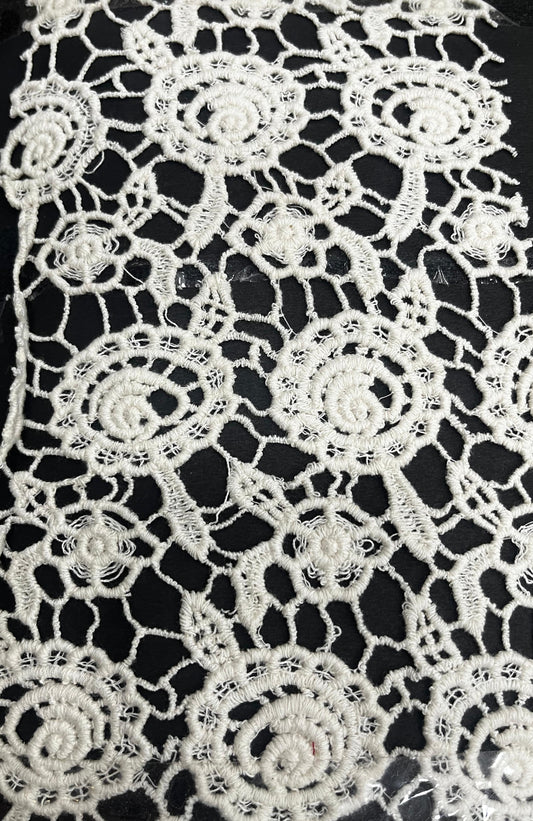 "Craft your dream outfit with this gorgeous 100% pure cotton GPO lace fabric! This dyeable white guipure textile features a stunning, intricate floral and rosette motif with exquisite detailing. Its super soft and breathable texture makes it the perfect summer fabric for tailoring light beach cover-ups, high-fashion overlays, breezy ethnic kurtis, or stylish Indo-Western dresses!"