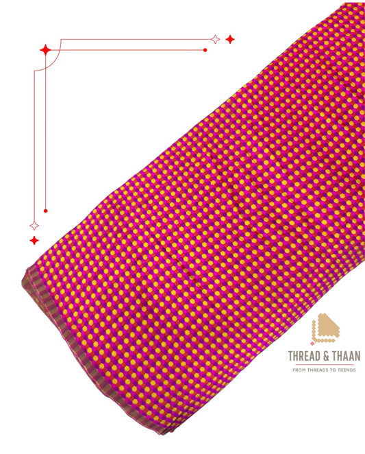 Vibrant pink silk brocade fabric featuring yellow dot motifs for sarees and blouses