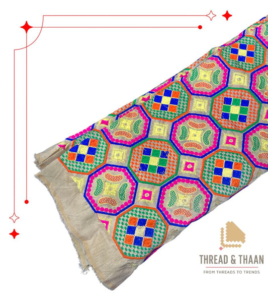 Premium silk brocade fabric featuring colorful geometric hexagon motifs for ethnic wear