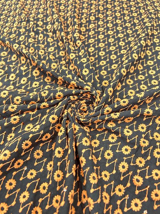 Black contrast floral embroidered fabric with yellow thread and sequin work for festive wear