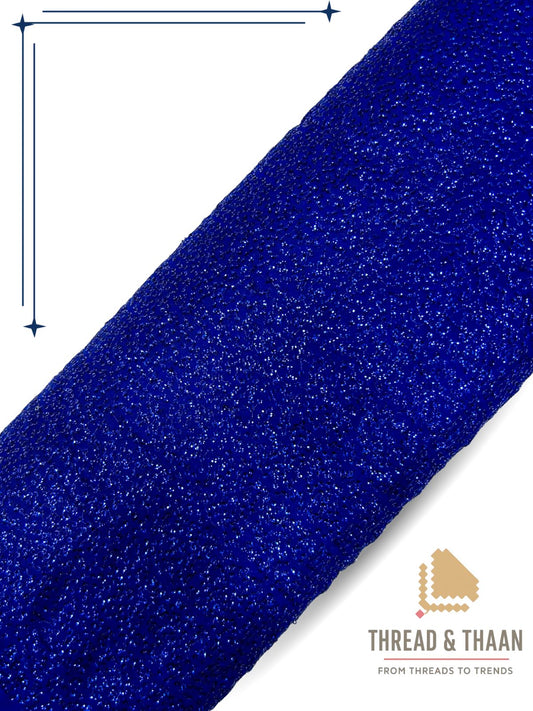 Blue shimmering georgette fabric with sparkling textured pattern for fashion wear