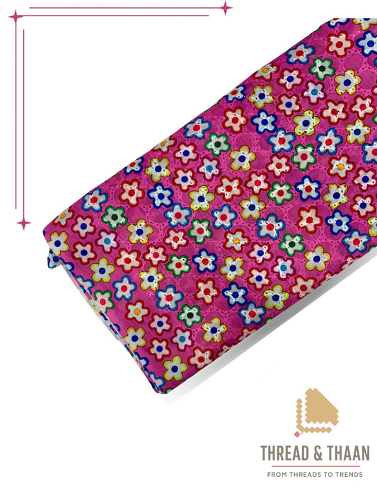 Vibrant hot pink pure cotton Hakoba fabric with multicolor floral print and delicate embroidery, perfect for stylish festive wear and summer dresses.