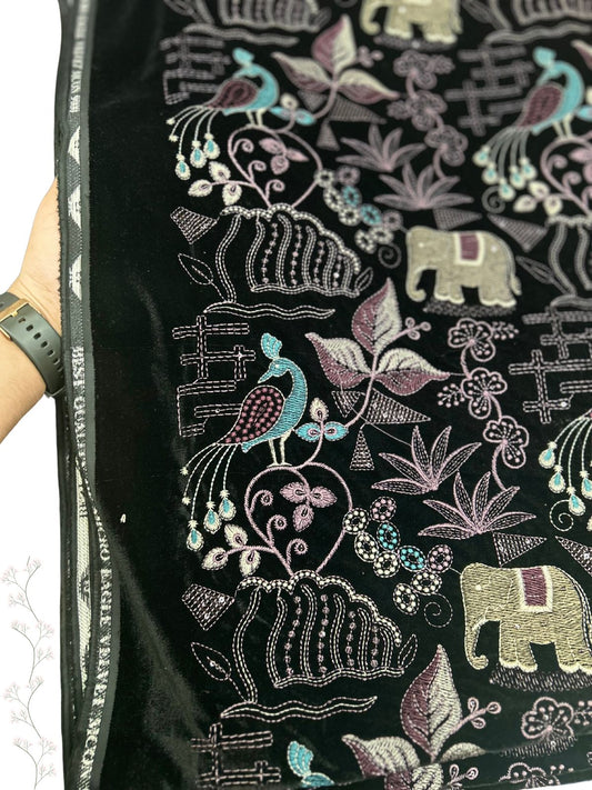  "Luxurious dark velvet fabric with beautiful embroidered elephants, peacocks, and floral designs in soft, inviting colors. Absolutely stunning!"