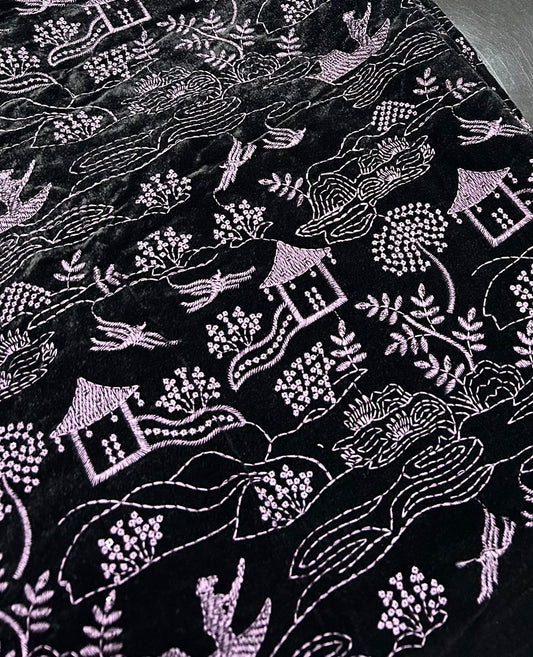 Premium winter velvet in dark purple featuring detailed scenic embroidery design.